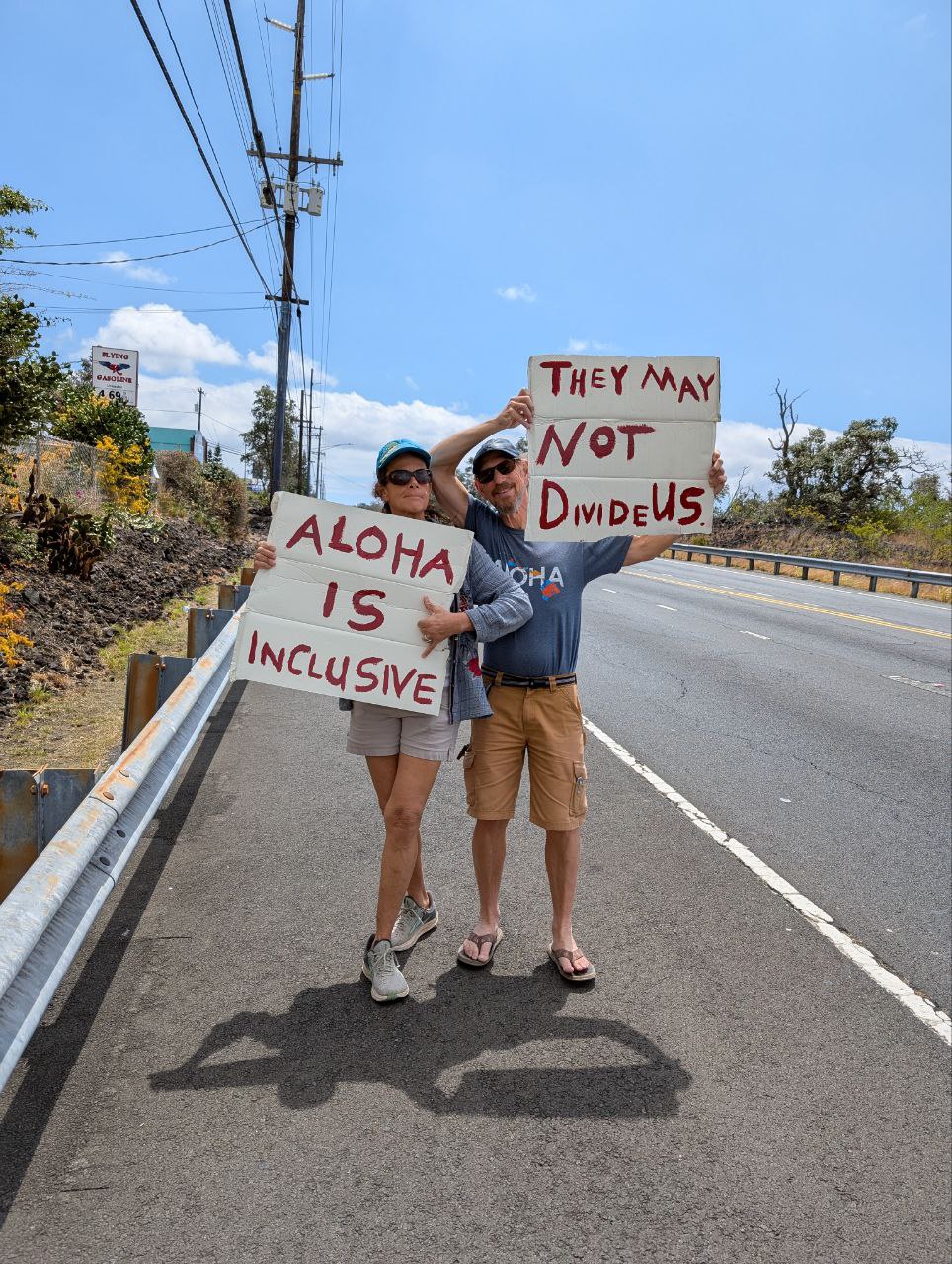 Aloha Is Inclusive sign on the highway